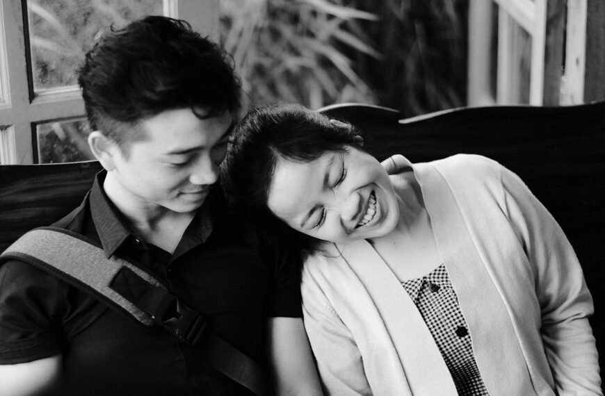 man kissing womans forehead